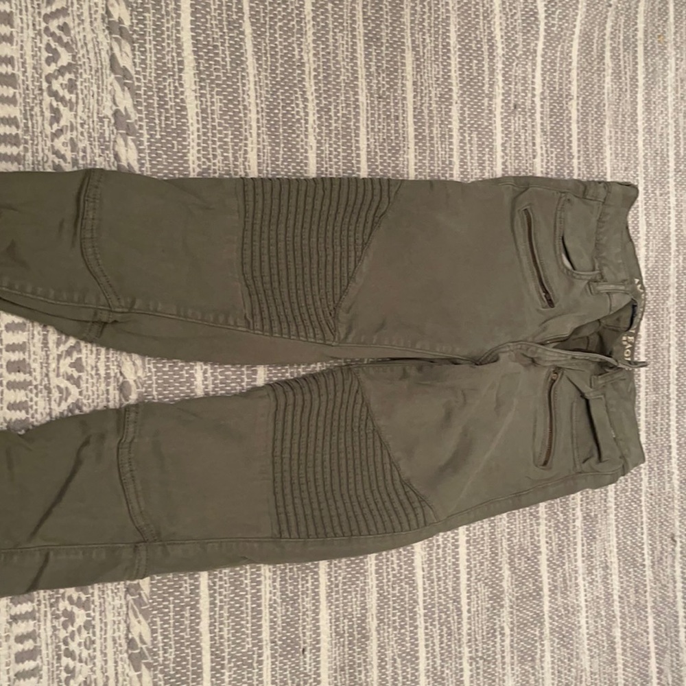 Green detailed jeans with zipper at the ankles